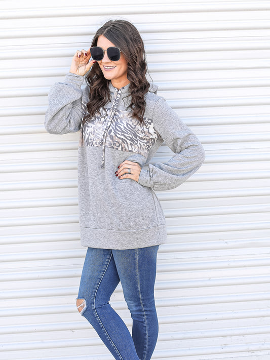 Looking for the sun in this warm animal print hoodie. 