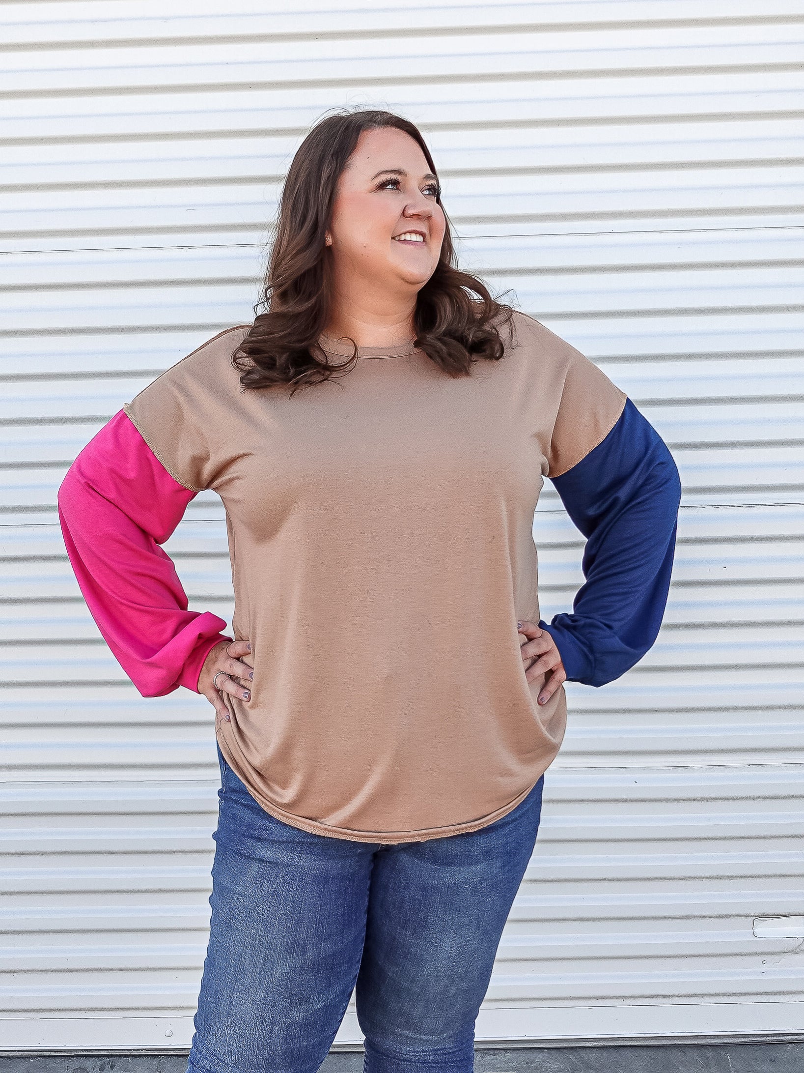 Casual long sleeve top with one blue and one pink sleeve. 