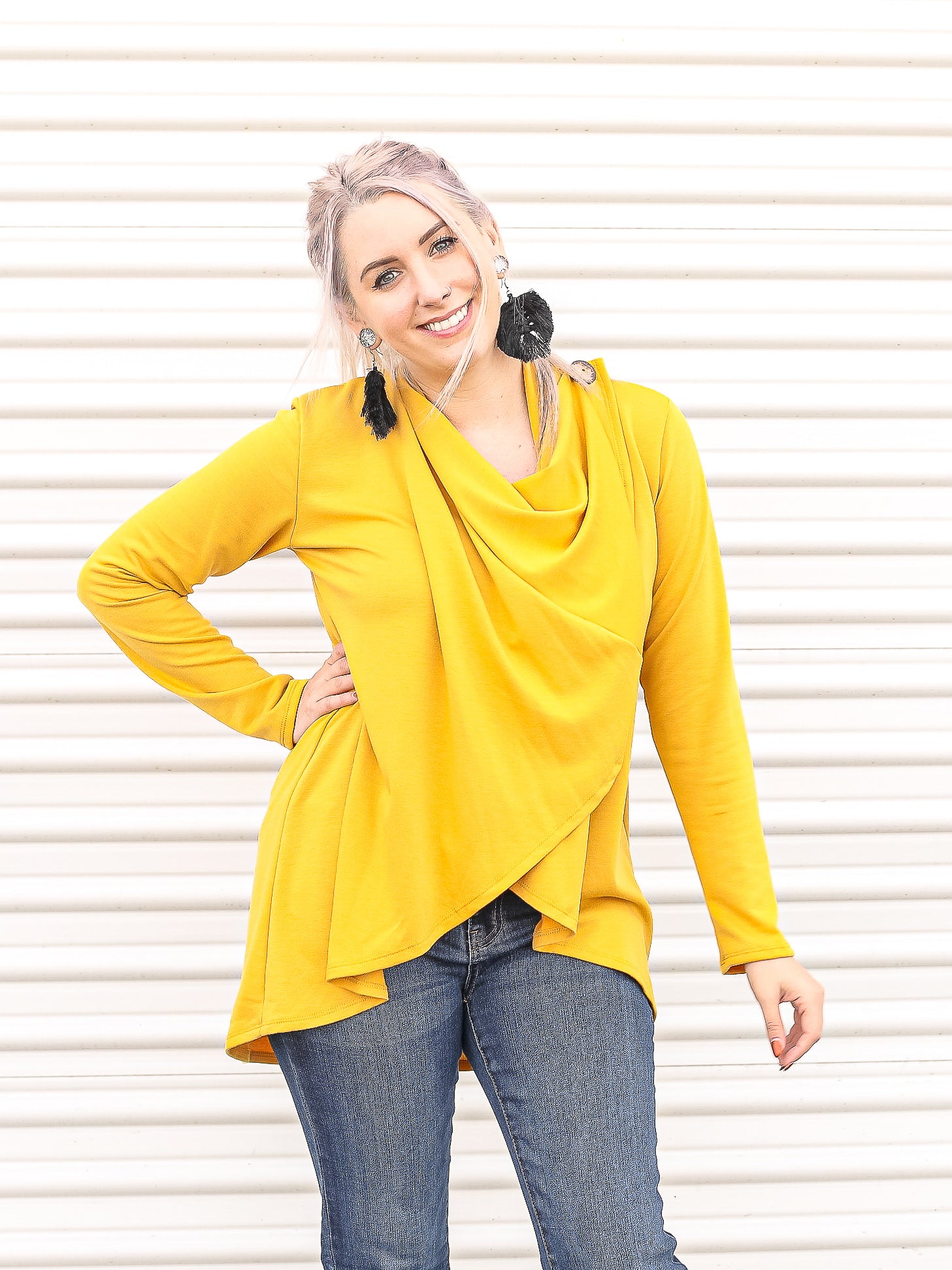 Yellow draped open front cardigan buttoned up. 