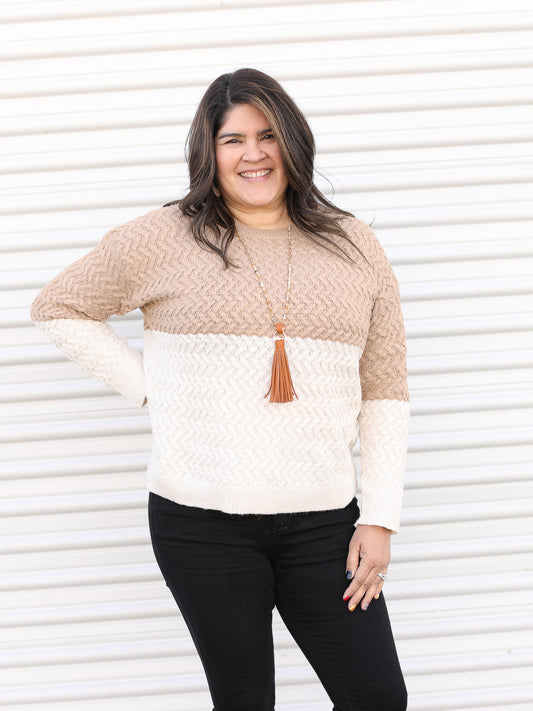 Classic sweater with colored block ivory on the bottom and light brown on the top.