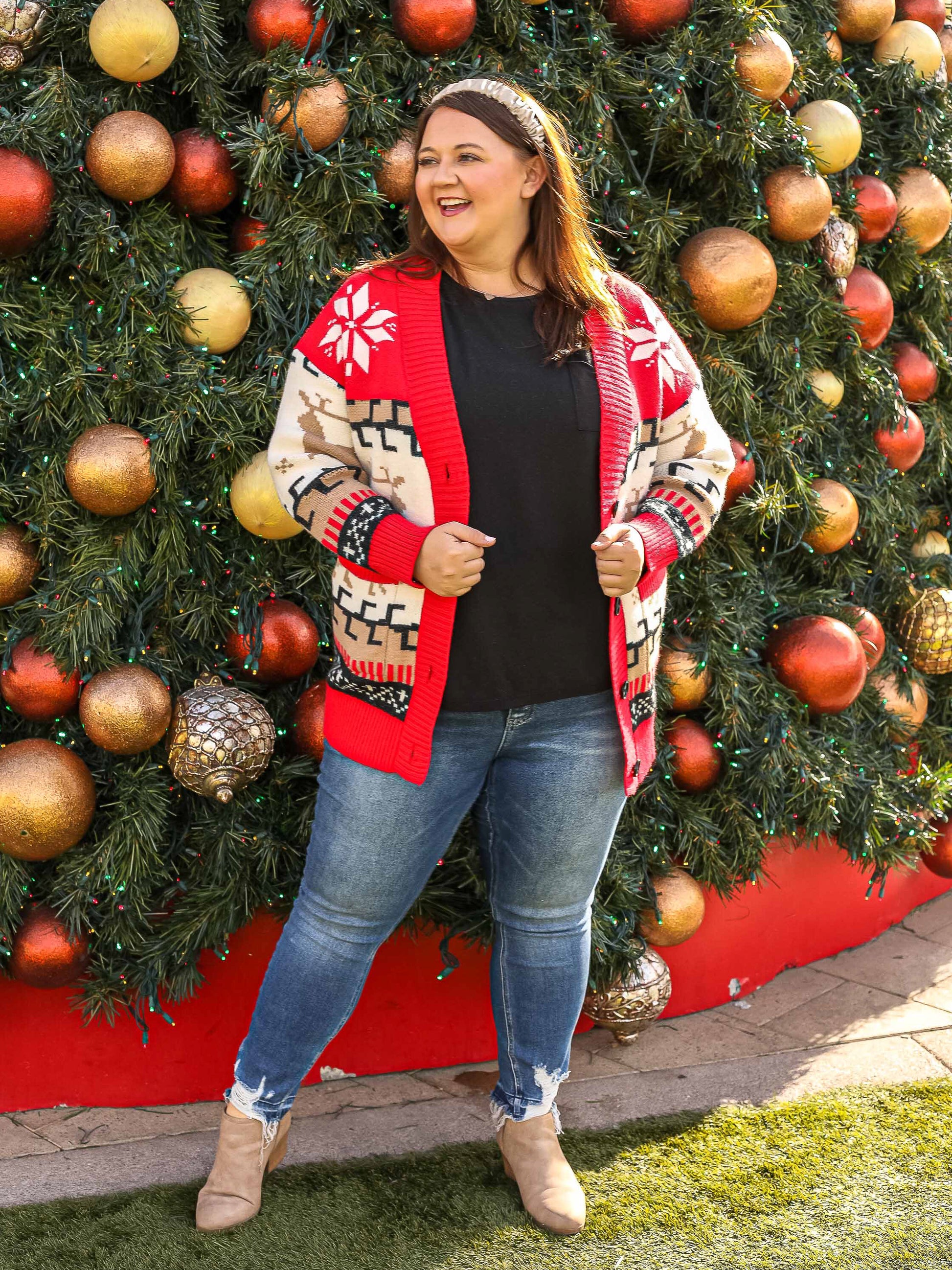 Front view of button down red reindeer open cardigan.