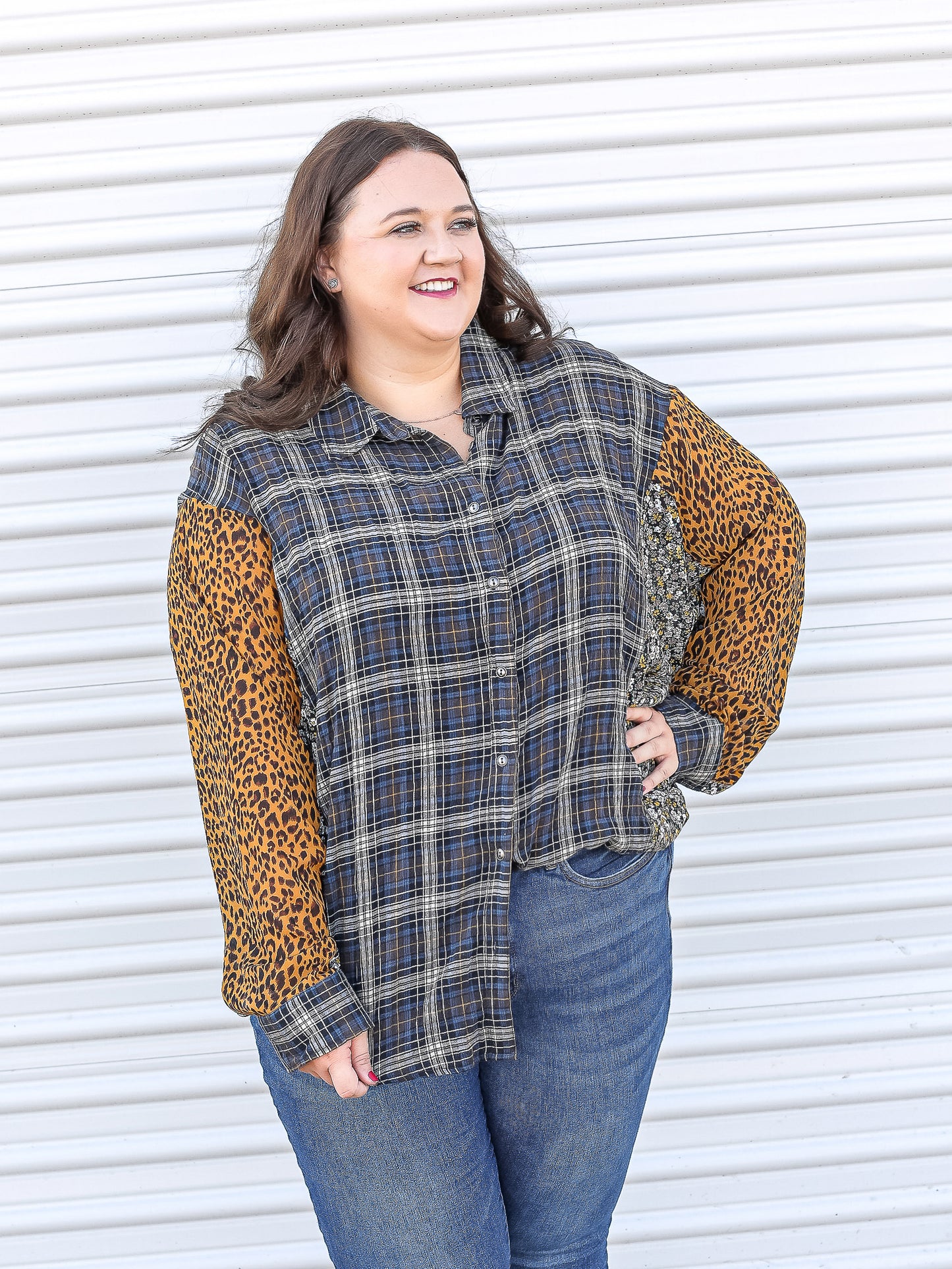 Plaid button down top with leopard and floral patterns on the sleeve. 