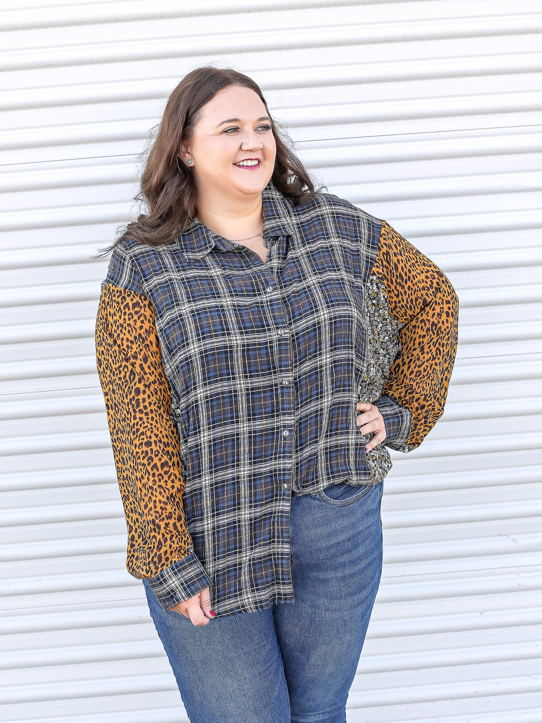 Plaid button down top with leopard and floral patterns on the sleeve. 