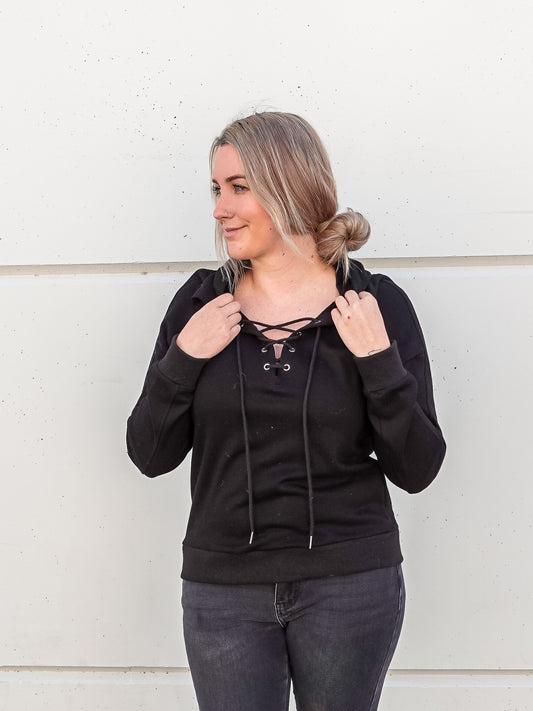 Simple black hoodie with lace up V-neck.