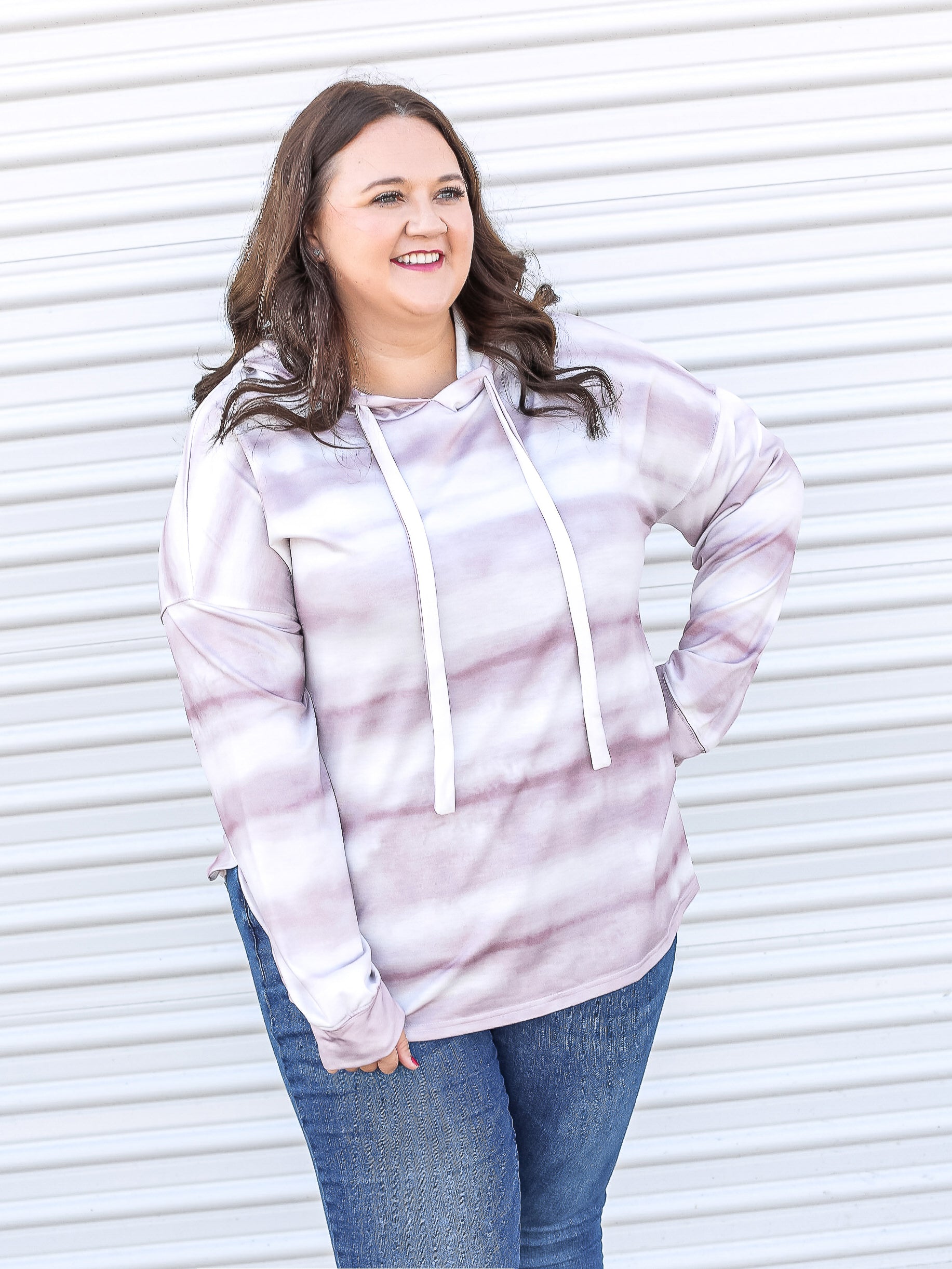 Mauve stripped tie-dye hoodie with white drawstring. 
