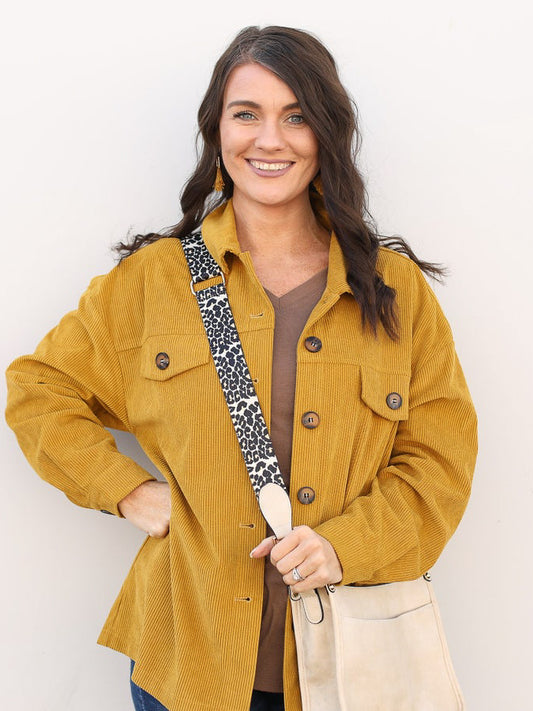 Mustard button up light weight jacket styled with a crossbody.