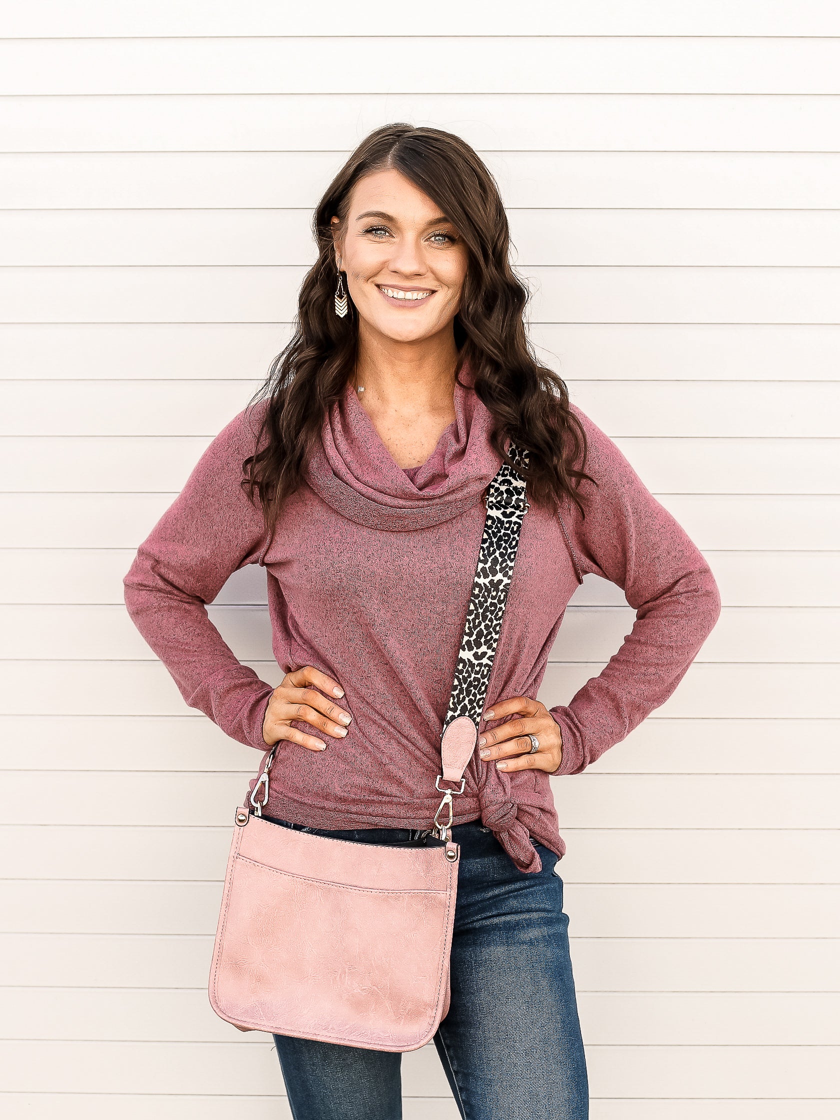 Mauve colored long sleeve top with cowl neck, styled with denim and a side knot