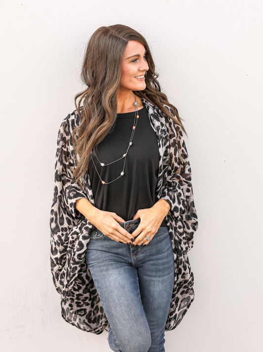 Leopard taupe and black kimono styled with a black shirt and denim.
