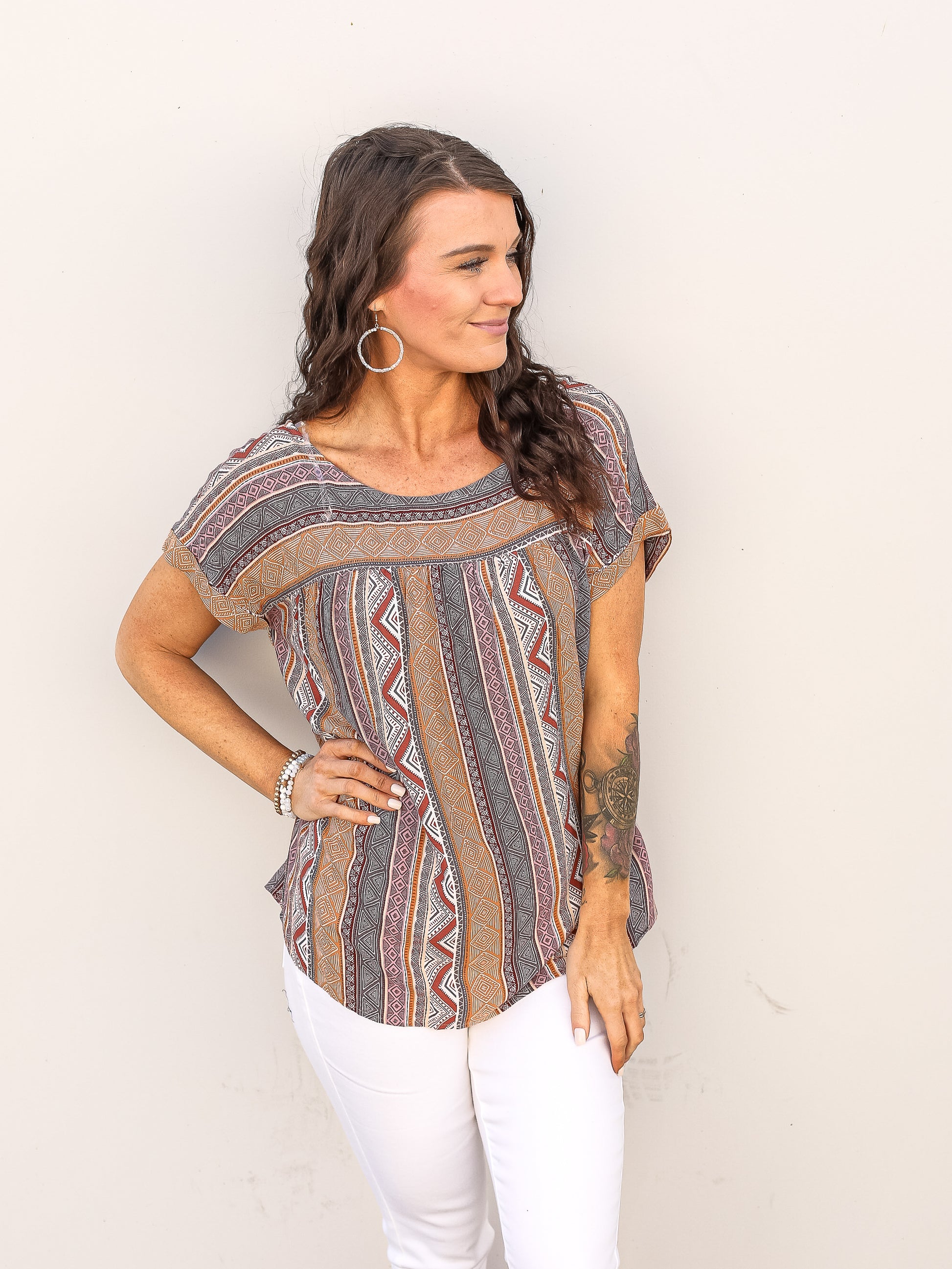 Short sleeve blouse with beautiful mixed tribal print details throughout. 
